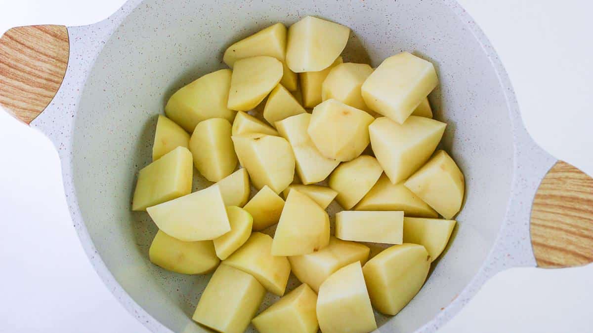 Cooked diced potatoes, in pan already drained.