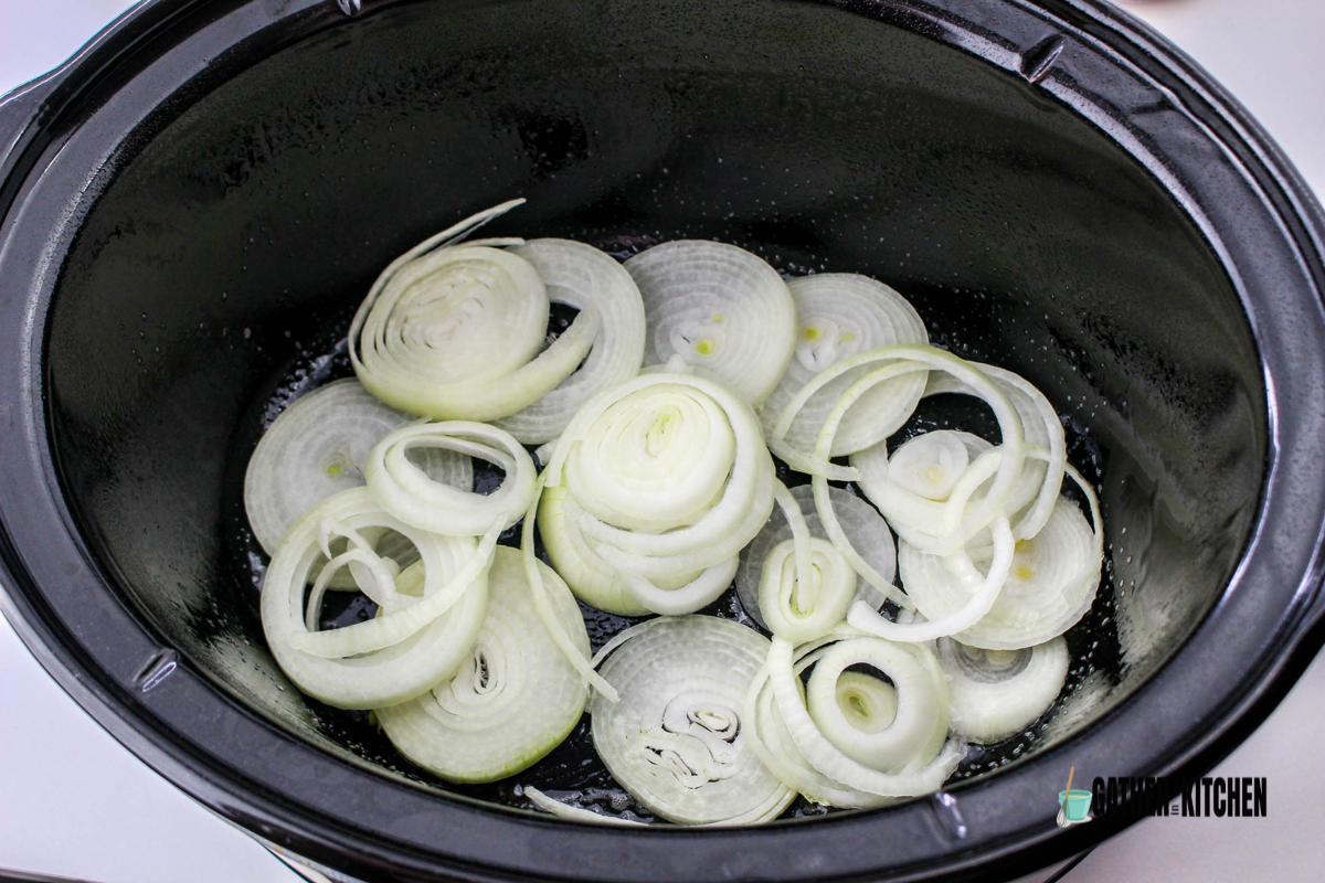 Onions at bottom of slow cooker.