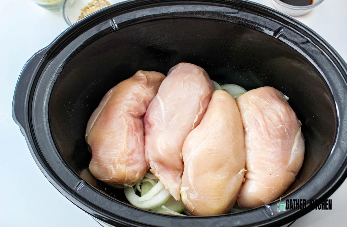 Chicken added to slow cooker.