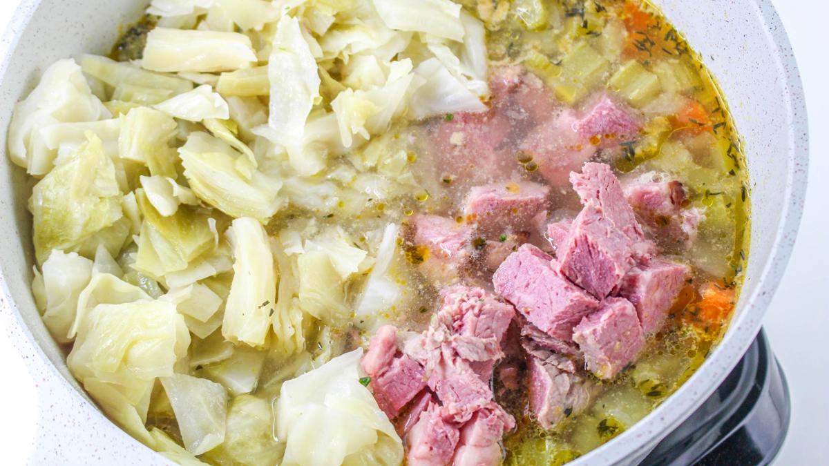 Cabbage and corned beef added to soup.
