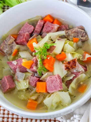 Bowl full of leftover corned beef and cabbage soup.