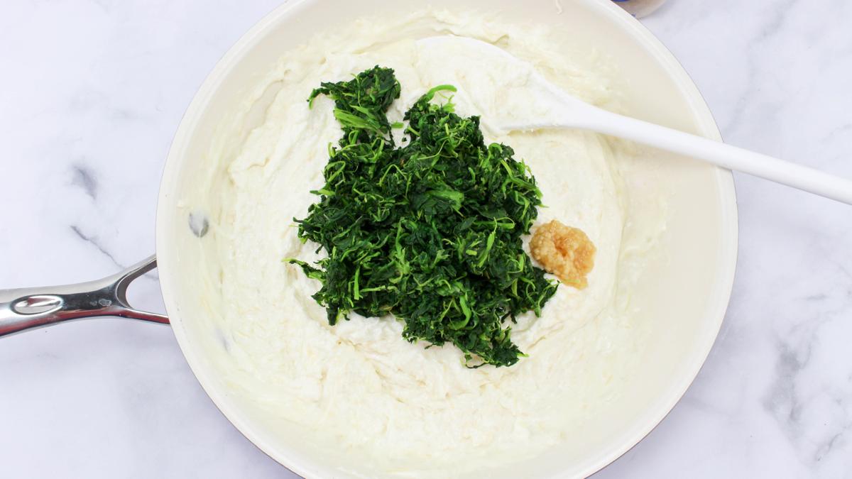 Spinach and garlic added to cheese mixture.