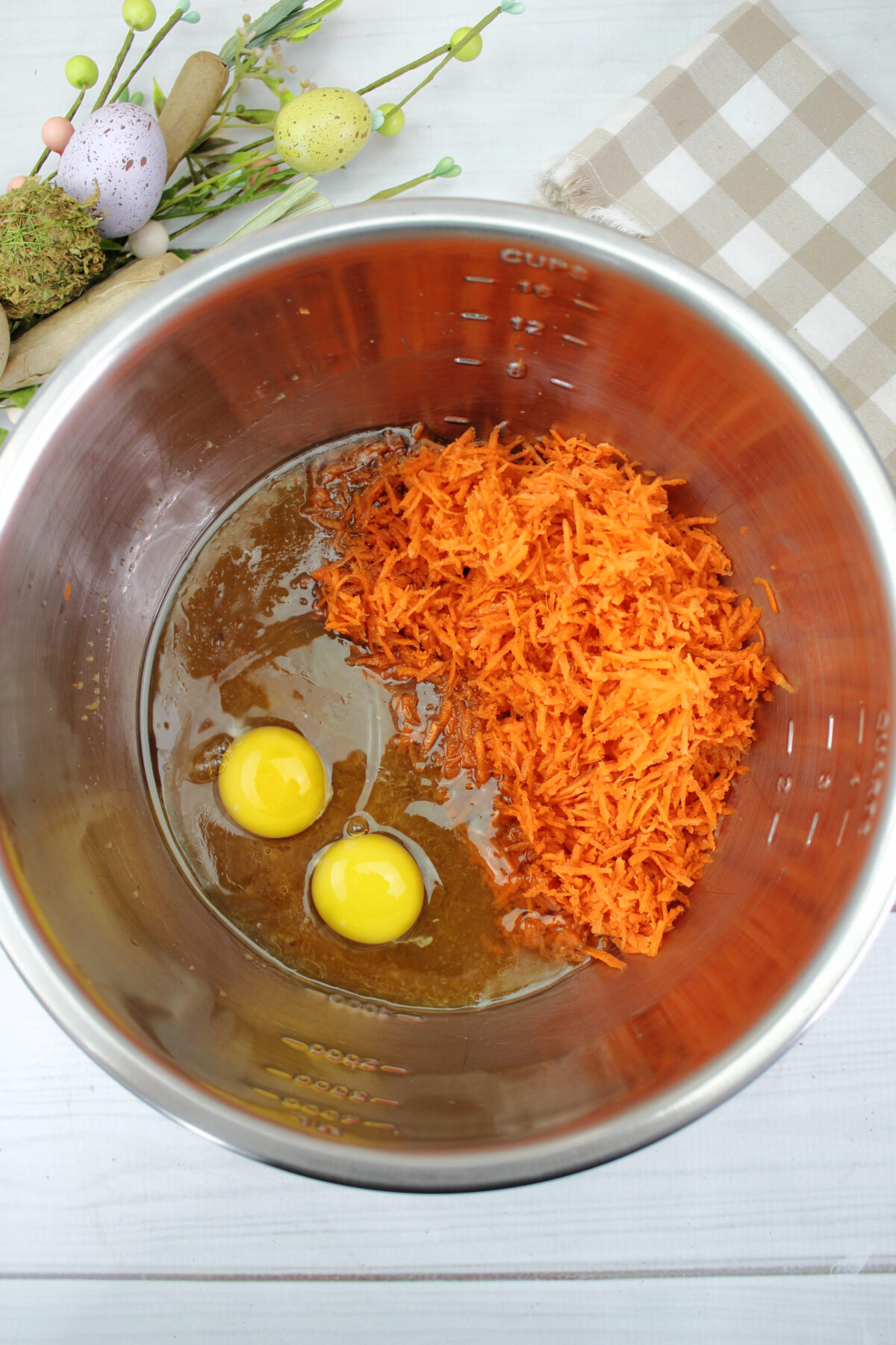 Shredded carrots and eggs on top of sugar-butter mix.