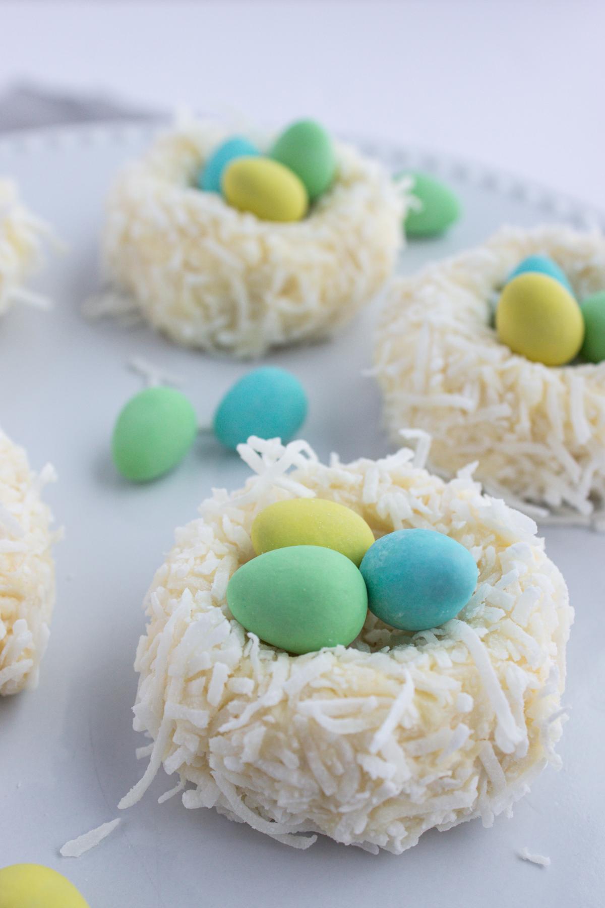 Mini cheeseball nests with "eggs" in them.