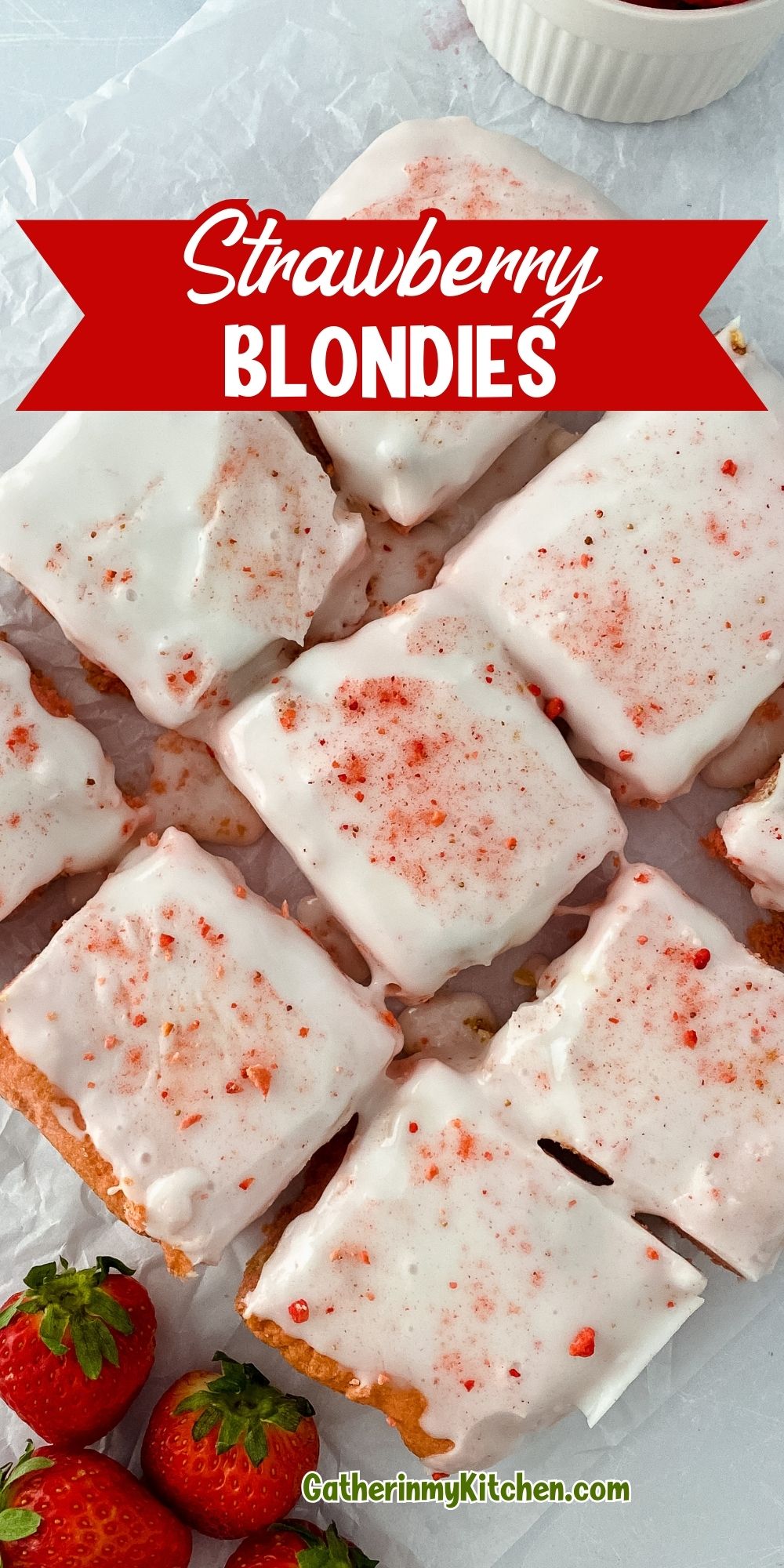 Pin image: cut blondies on parchment paper with the words "Strawberry Blondies" over the top.