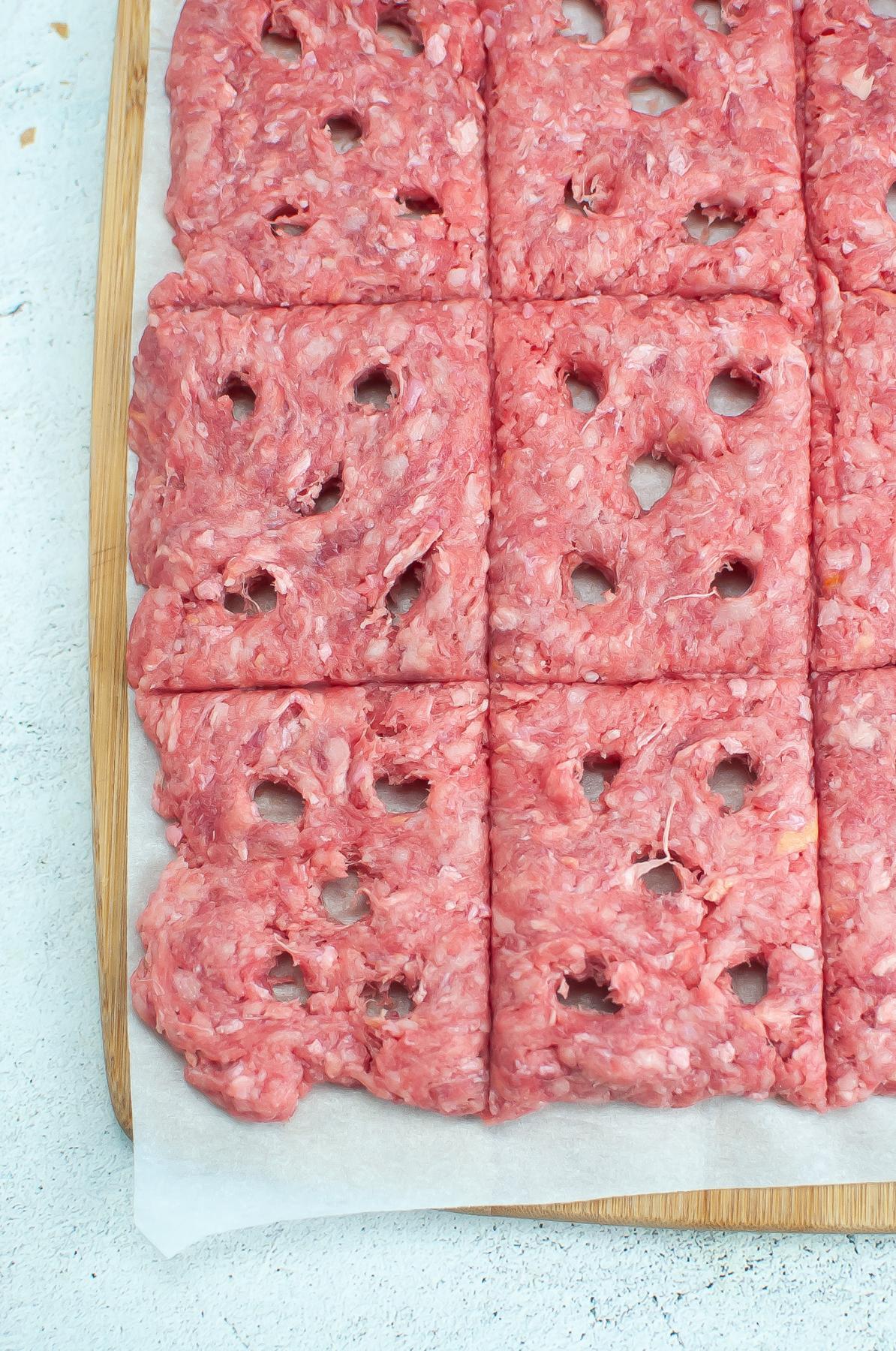 Hamburger meat with holes in it.