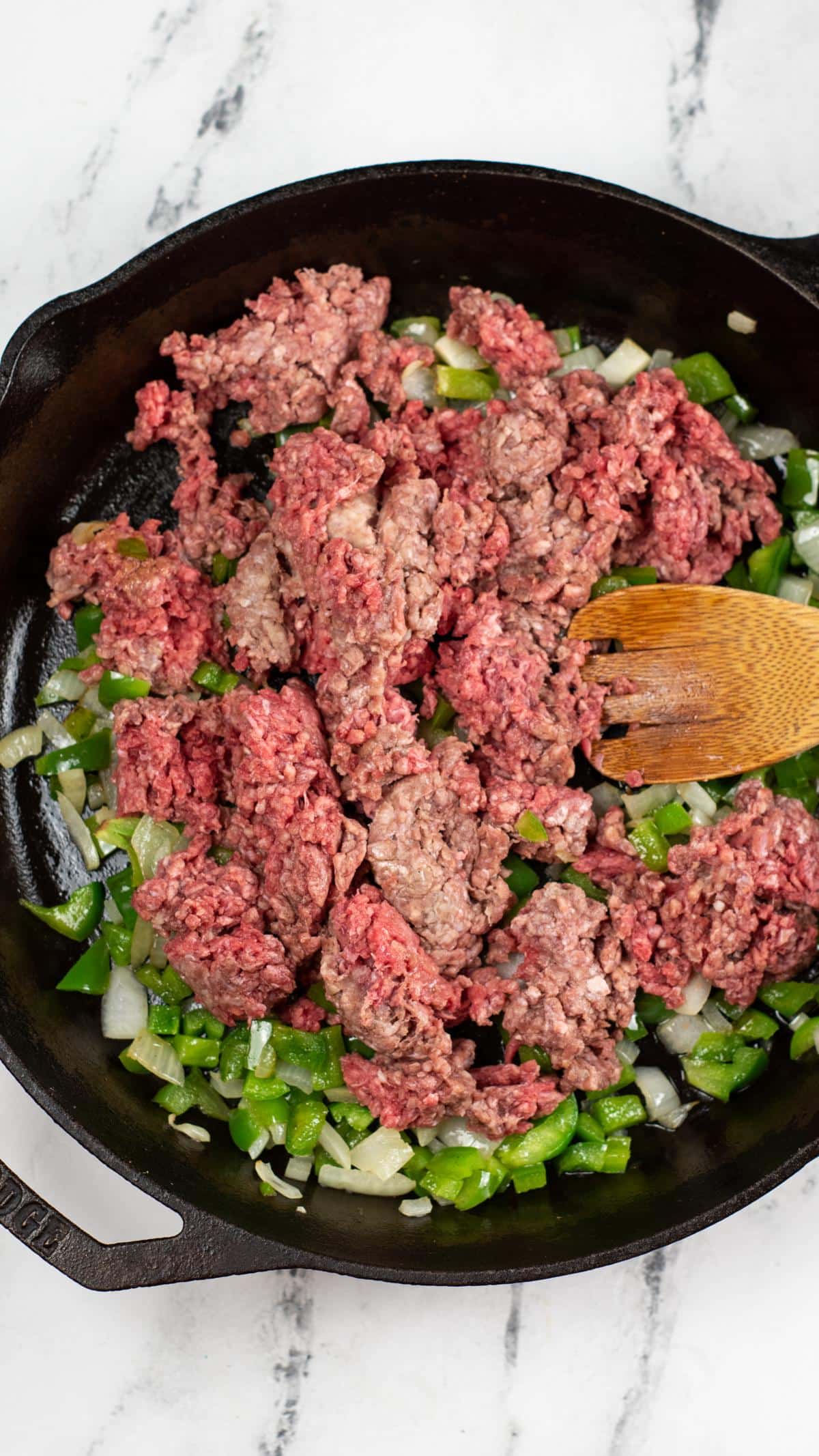 Meat added to pan.