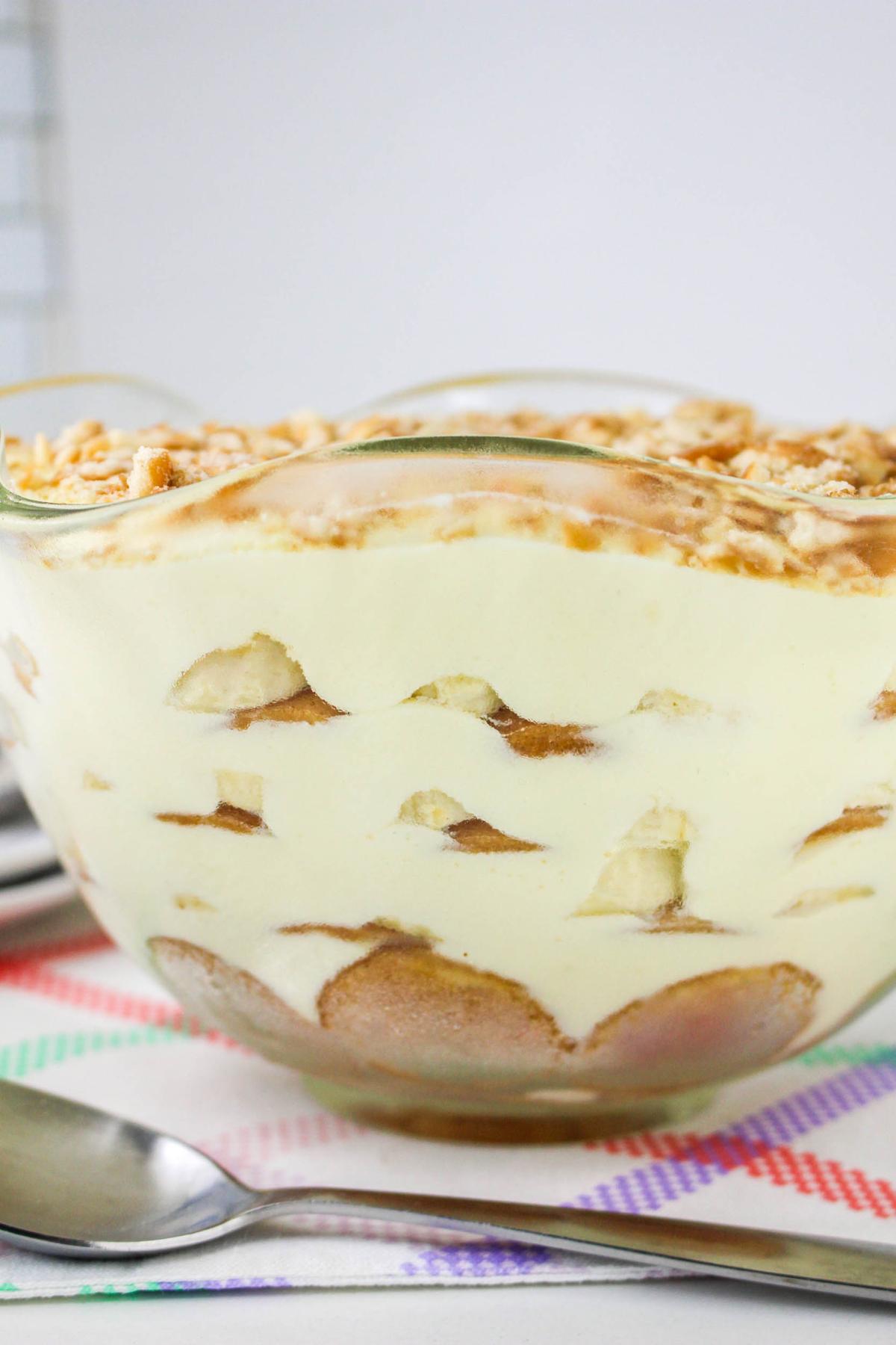 Side view of banana pudding in a clear bowl.