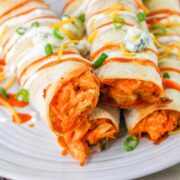 Buffalo chicken taquitos on a plate.