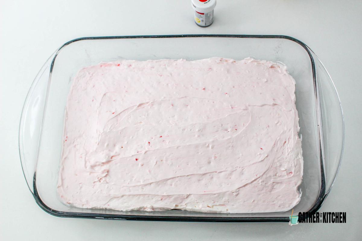 peppermint cream cheese mix spread in baking dish.