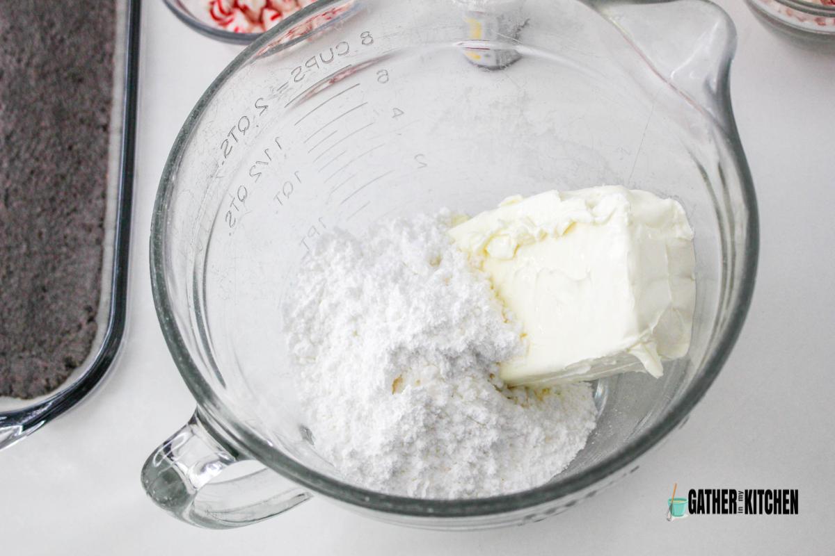 Powdered sugar and cream cheese in large mixing bowl.