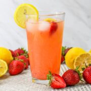 Glass of strawberry lemonade.